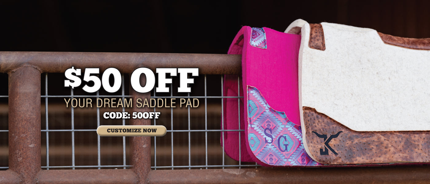 $50 off custom saddle pads displayed on a rustic metal fence.